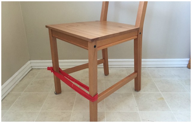 Put a rubber band on chair legs